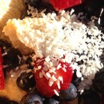 Raw Dairy Ice Cream with Blueberries Strawberries and Coconut Flakes